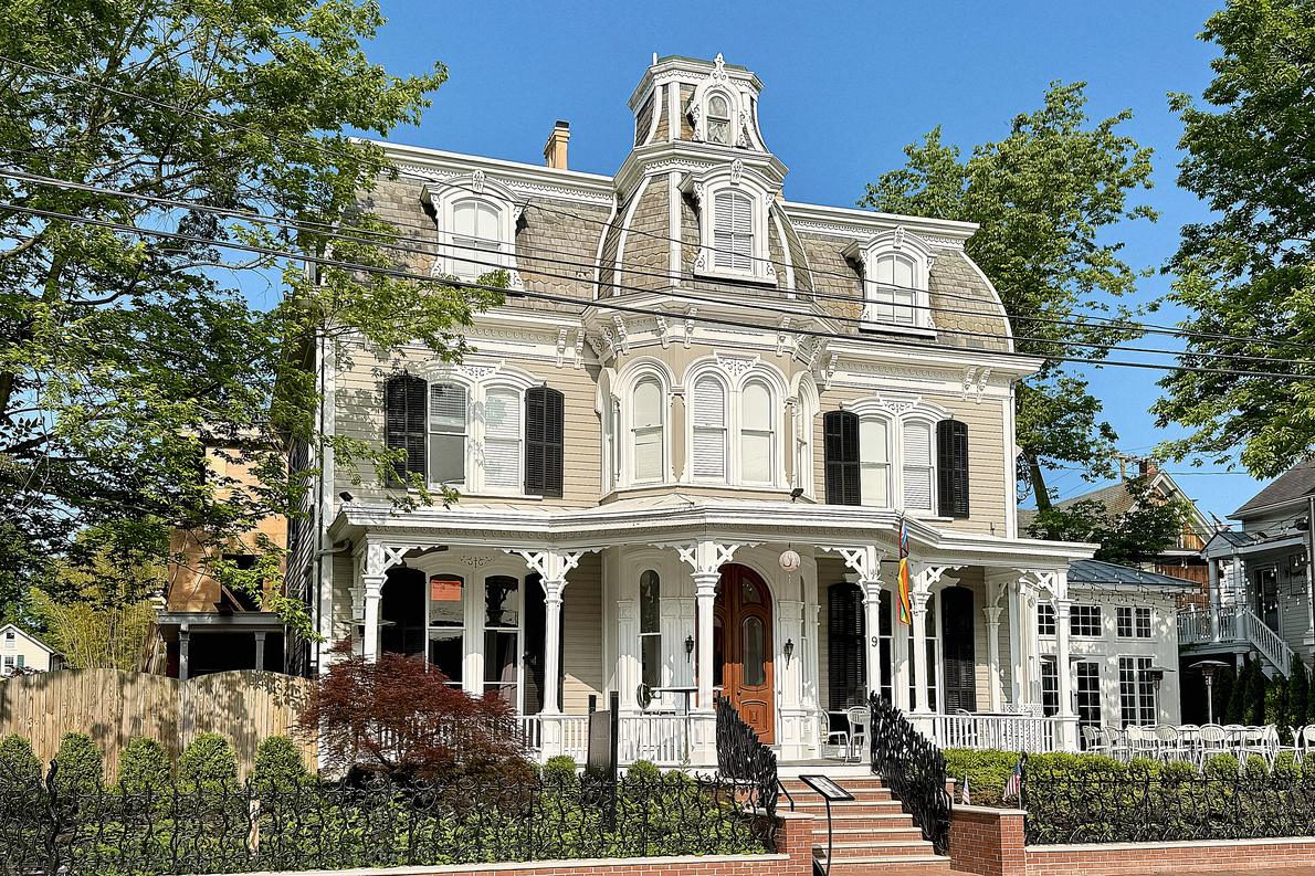 The Mansion Inn on South Main, one of the Victorians in the New Hope village district. Mansard roof, deep porch, and every bit of that trim on the inspection report.
